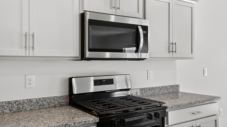 Kitchen with island and cabinets.