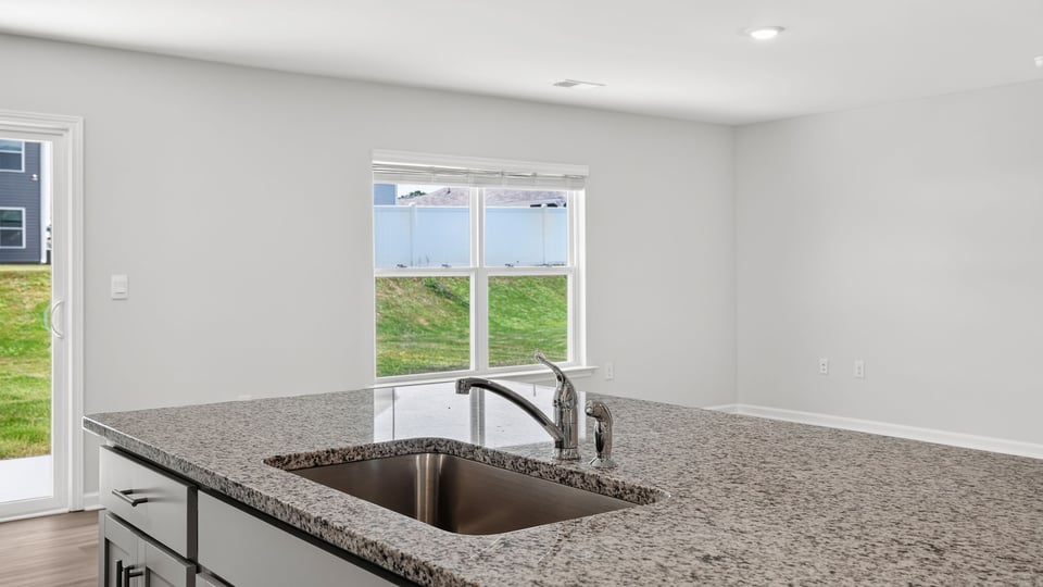 Kitchen with island and cabinets.