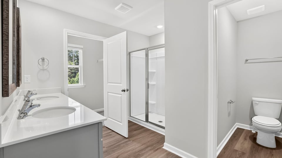 Primary bathroom with double vanity sink.