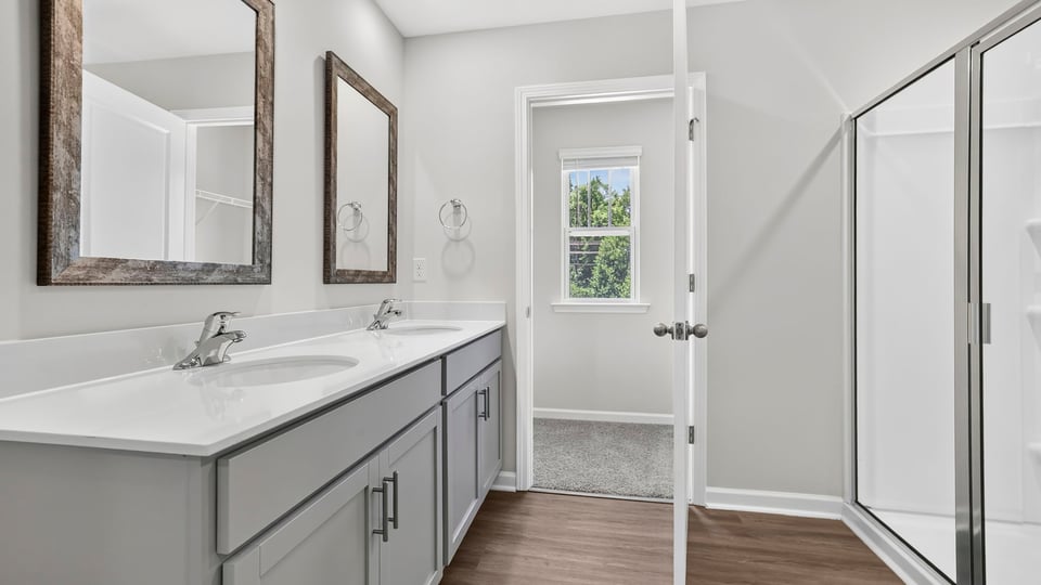 Primary bathroom with double vanity sink.