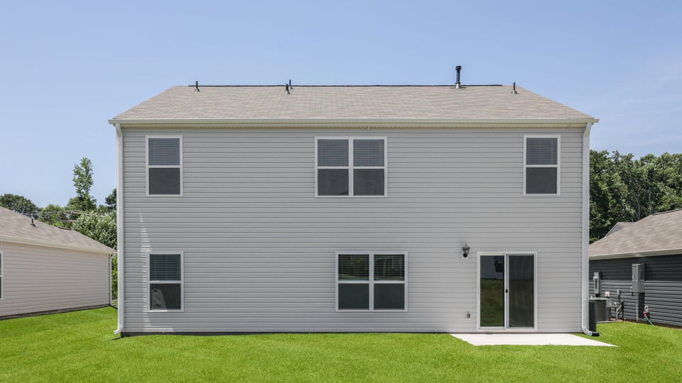 Back exterior with large backyard.