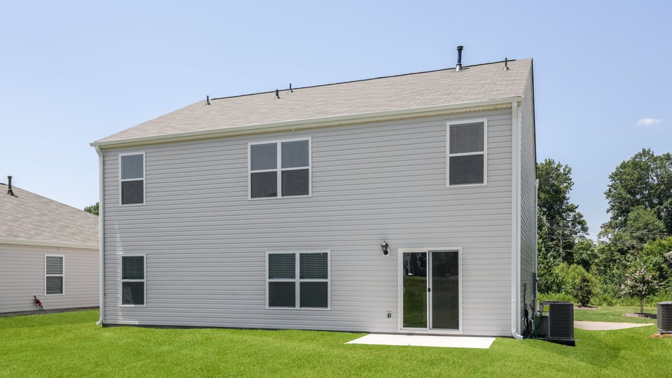 Back exterior with large backyard.