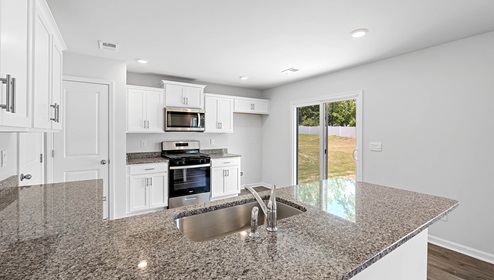 Kitchen with granite counter tops.
