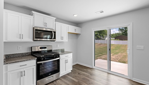 Kitchen with granite counter tops.