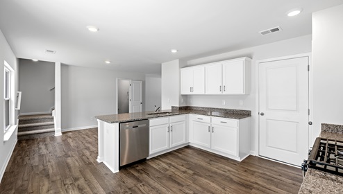 Kitchen with granite counter tops.