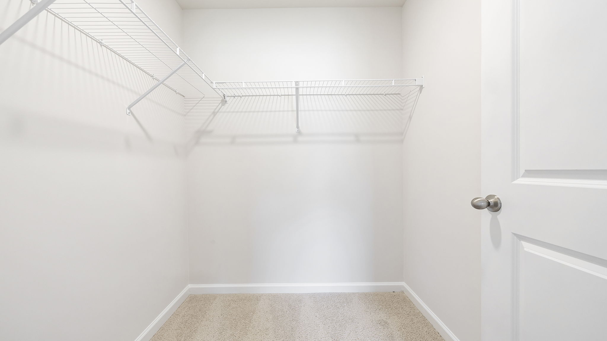 Closet with hanging storage rack.