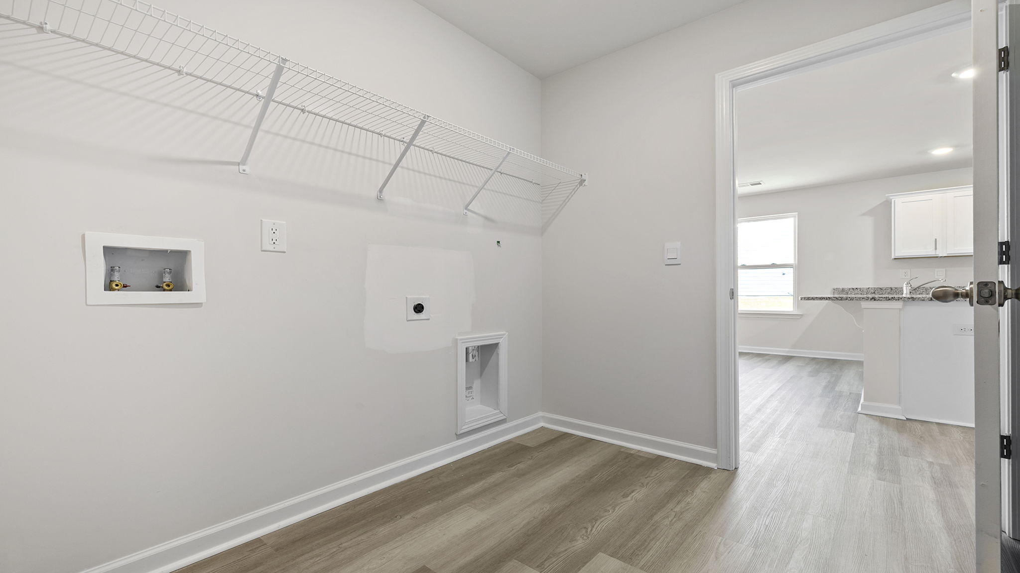 Closet with hanging storage rack.