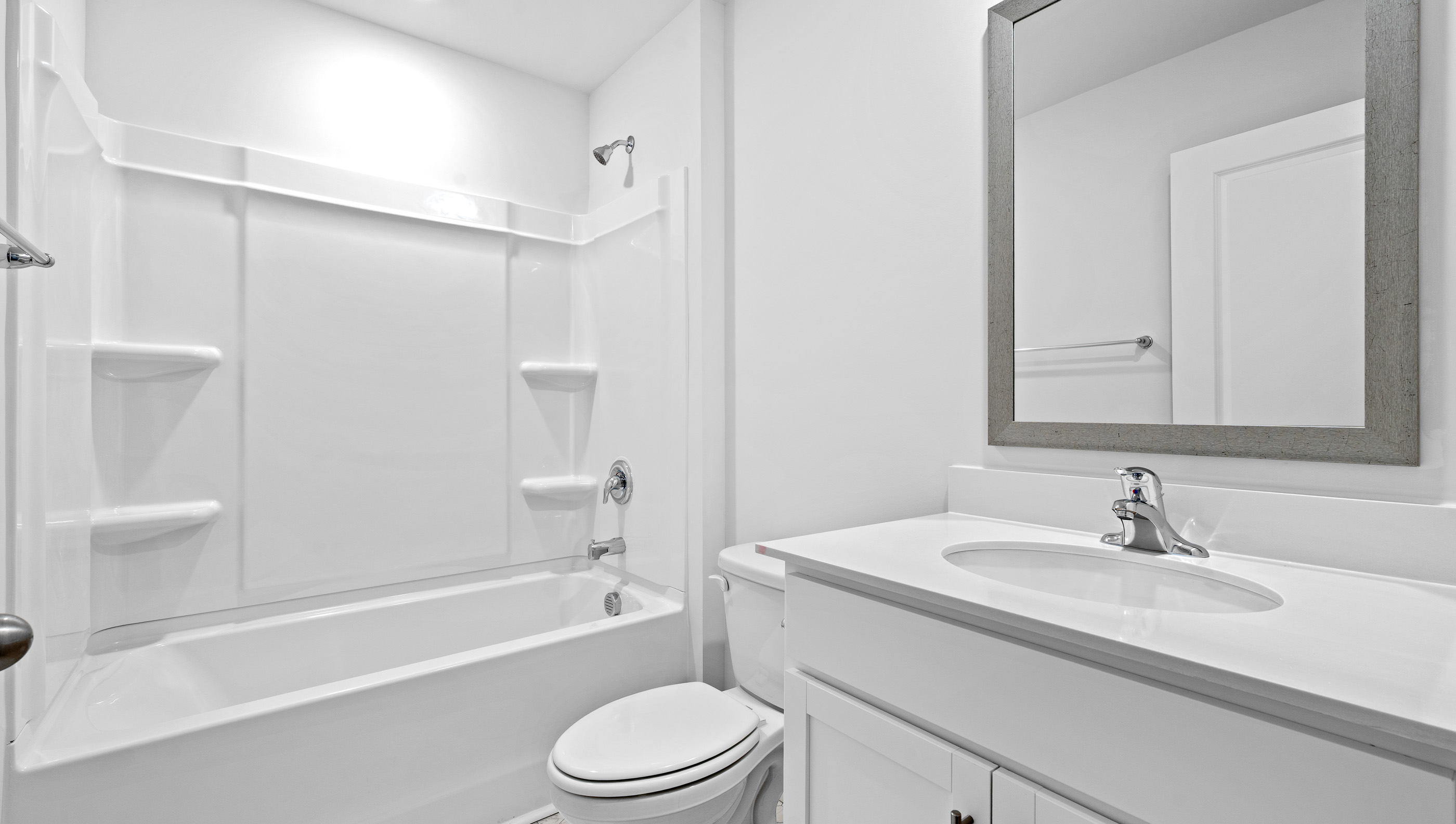 Bathroom with tub and single vanity sink.