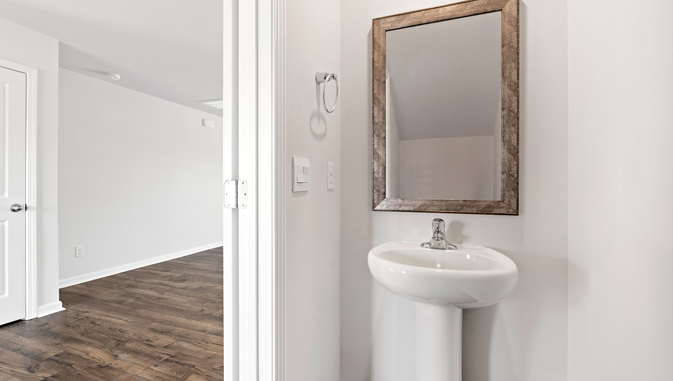 Half bathroom with mirror.