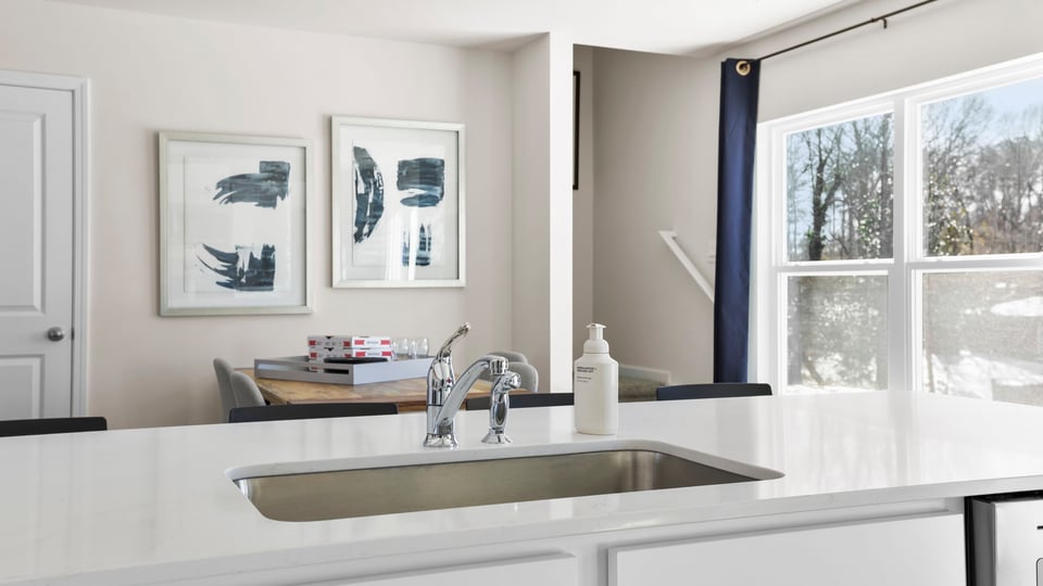 Kitchen with cabinets and windows.