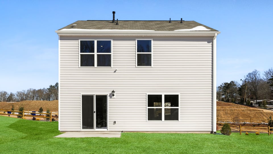 Back exterior with large backyard.