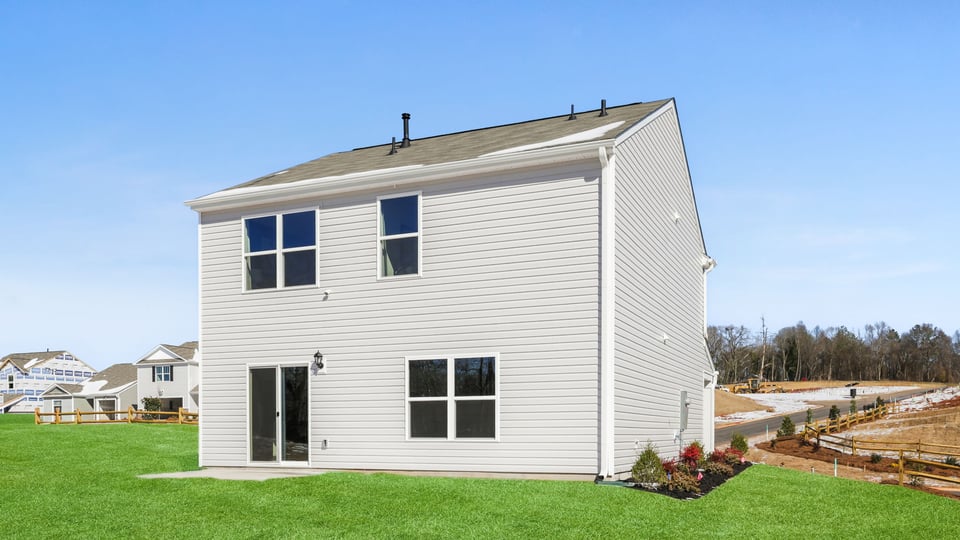 Back exterior with large backyard.