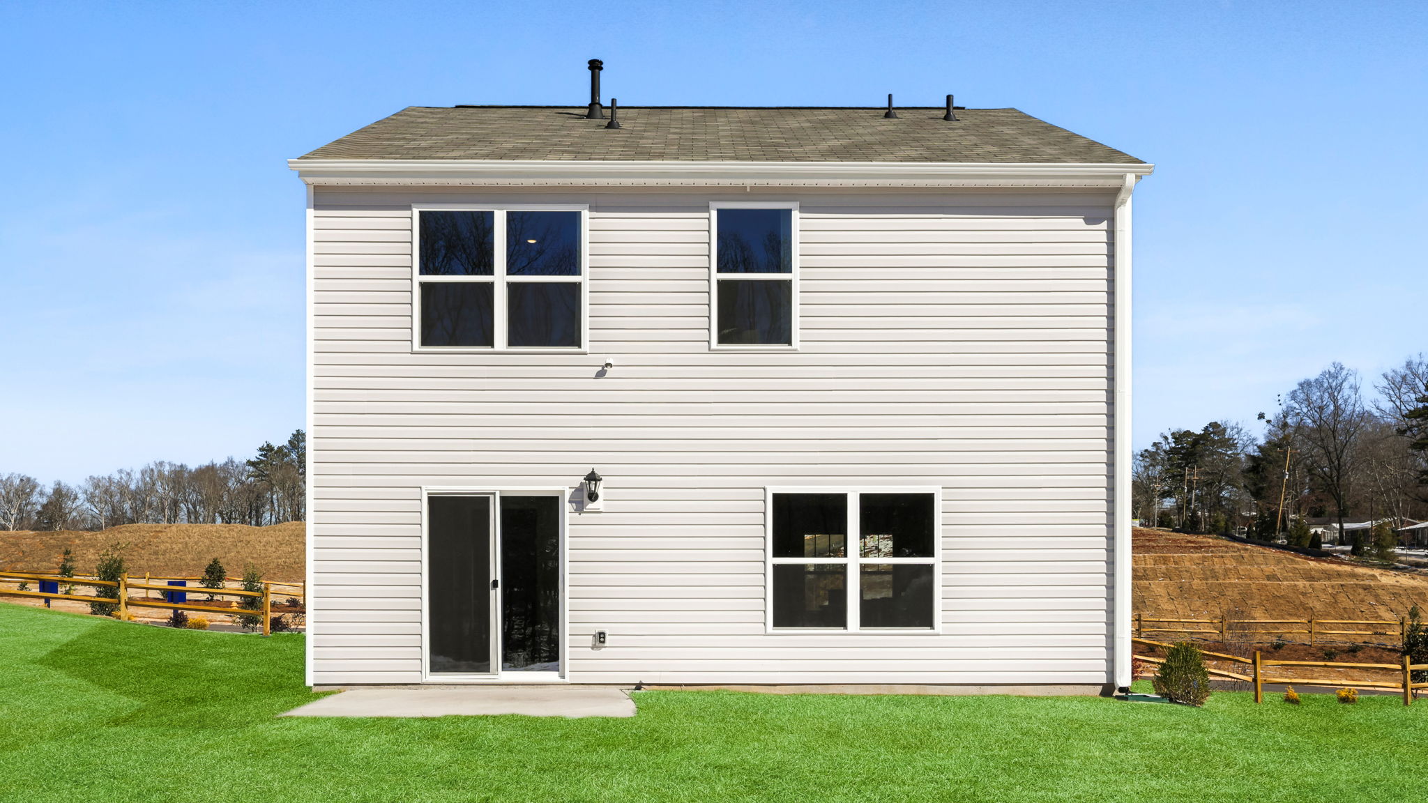 Back exterior with large backyard.
