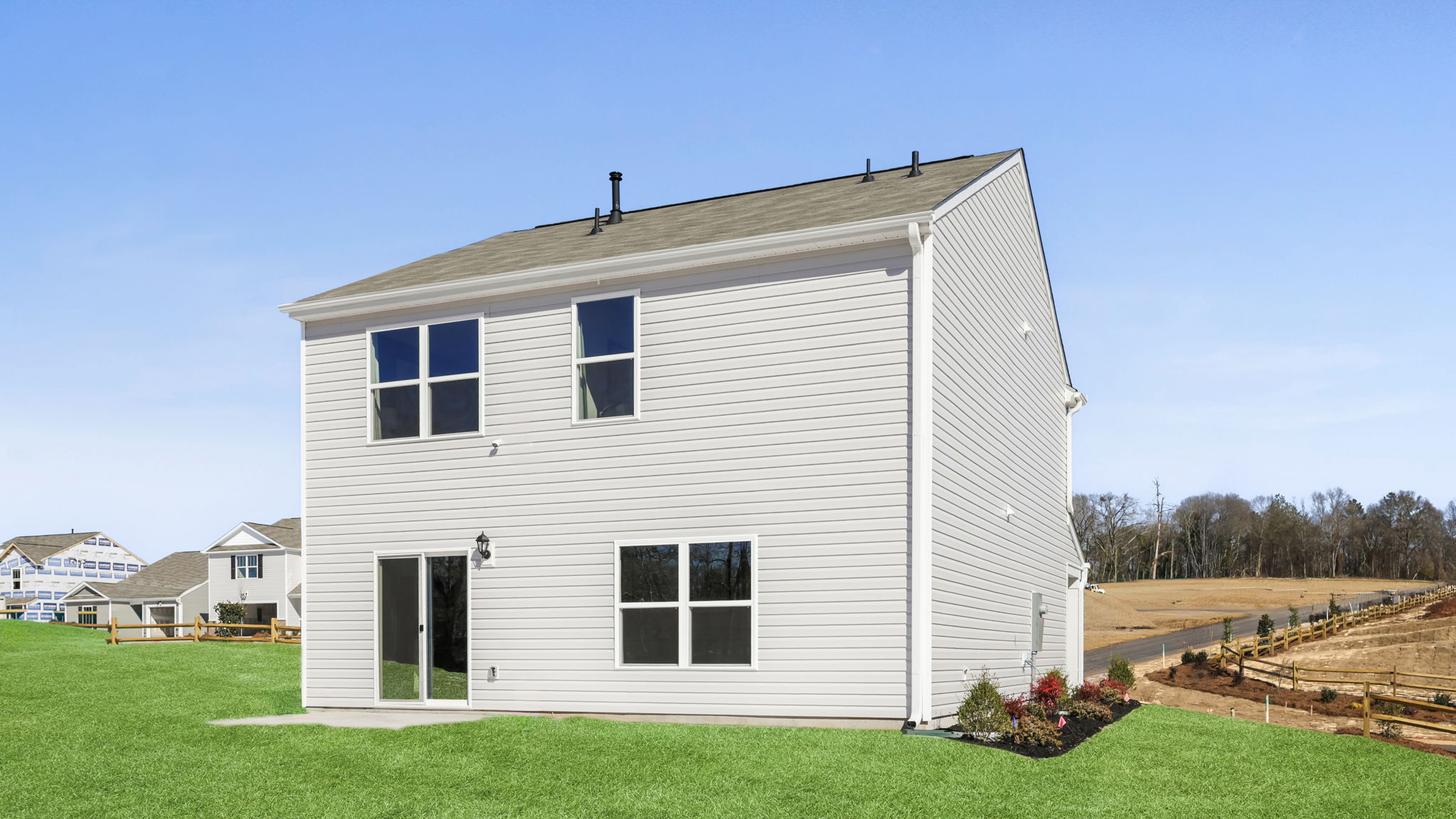 Back exterior with large backyard.