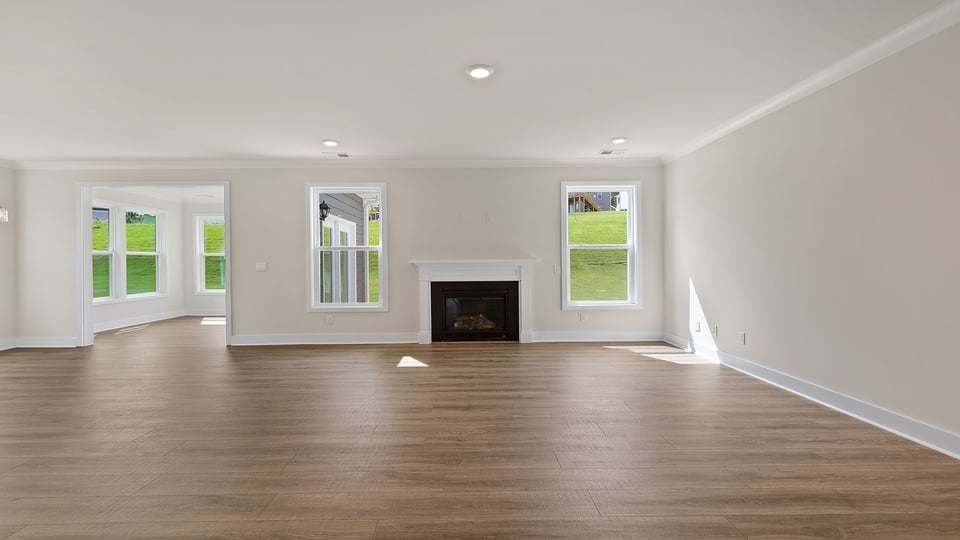 Living area with windows and fireplace.