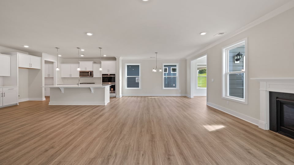 Living area with windows and fireplace.