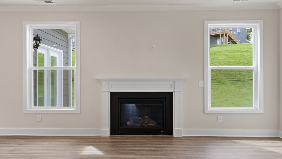 Living area with windows and fireplace.