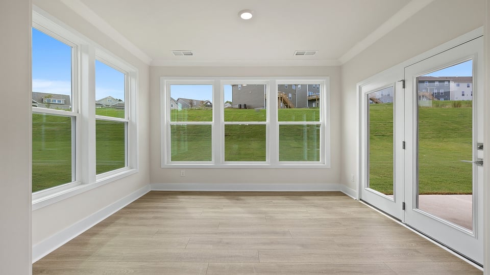Living area with windows and fireplace.