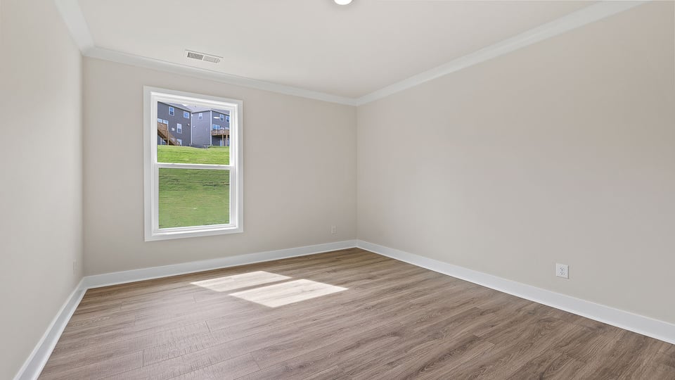 Bedroom with window and closet.