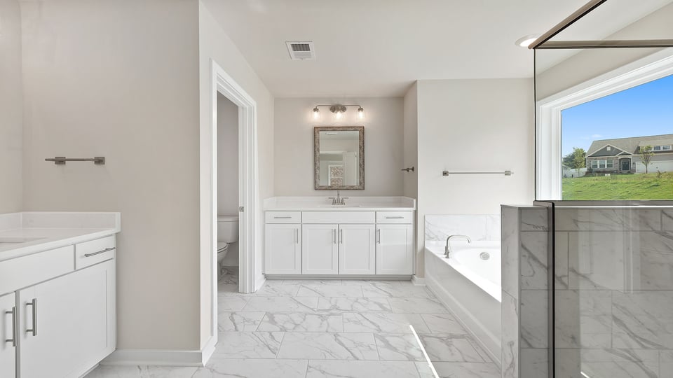 Primary bathroom with double vanity sinks.