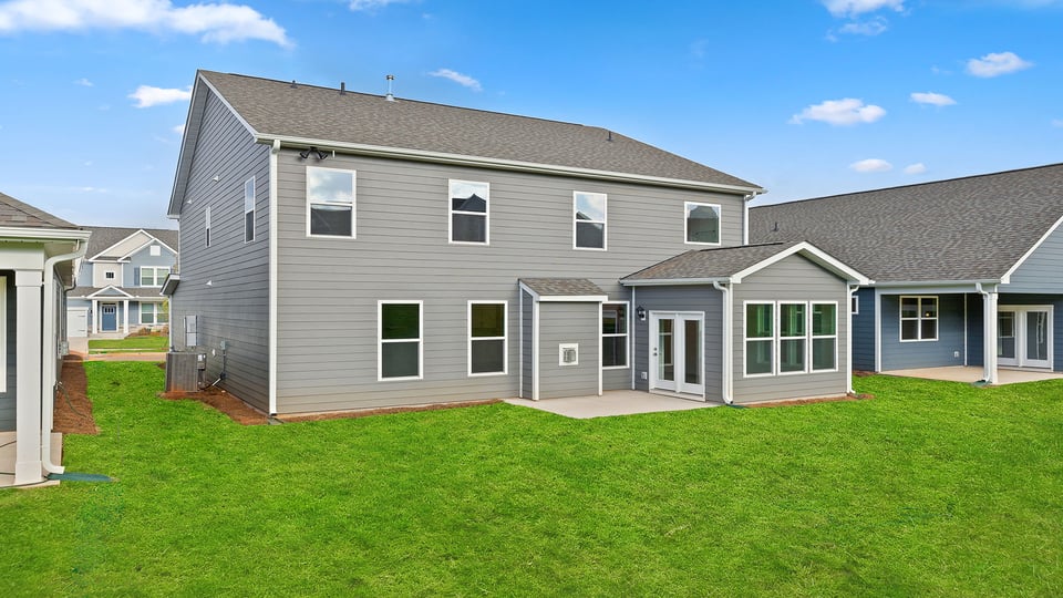 Back exterior with large backyard.
