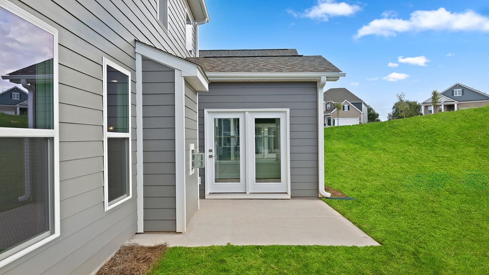Back exterior with large backyard.