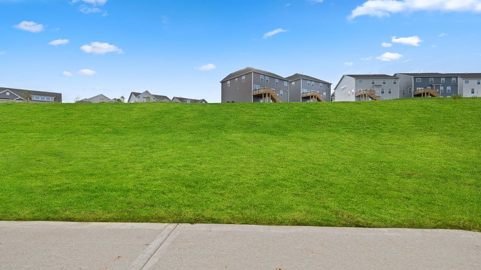 Back exterior with large backyard.