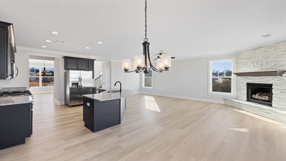 Kitchen with cabinets and window.