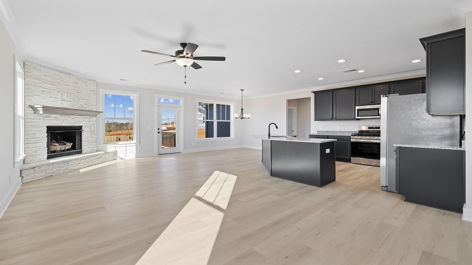 Kitchen with cabinets and window.