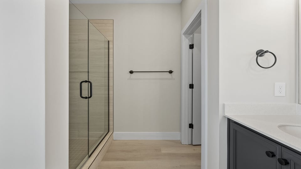 Primary bathroom with double vanity sinks.