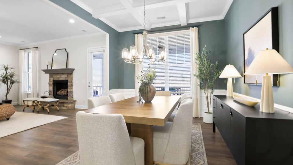 Formal dining room with view of windows and door to patio.