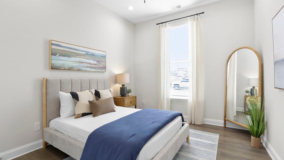 Bedroom with large window.