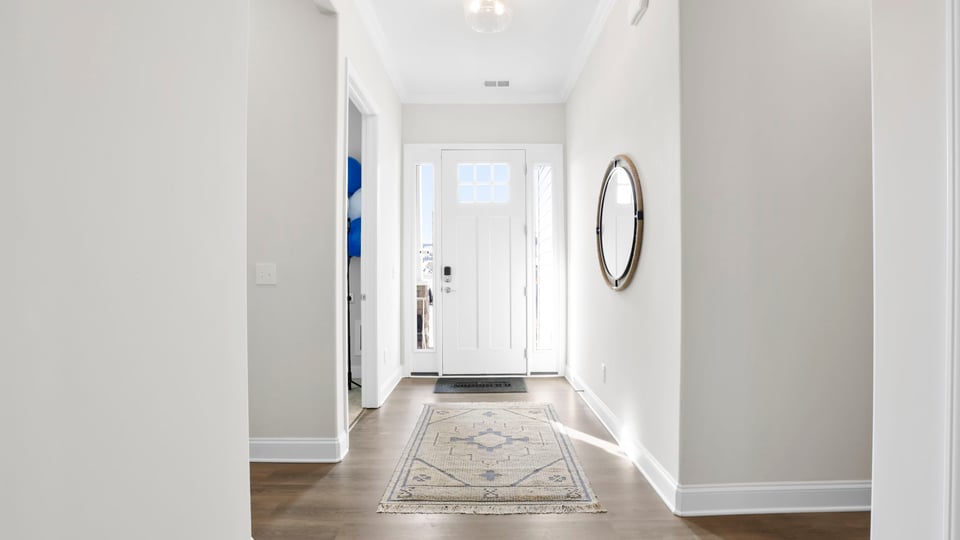 Foyer view of front door entrance.
