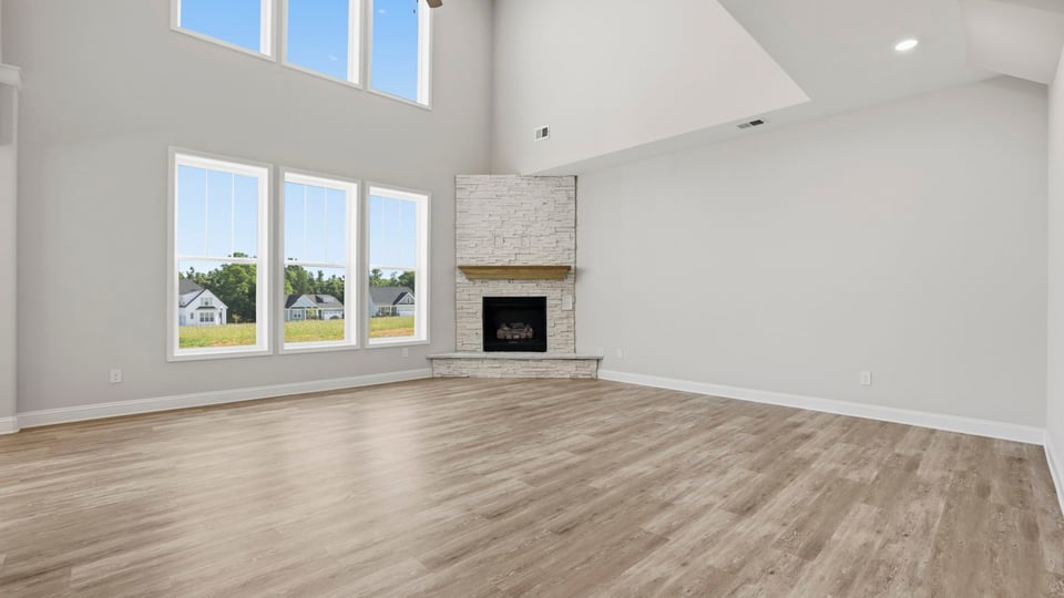 Family room with windows and fireplace.