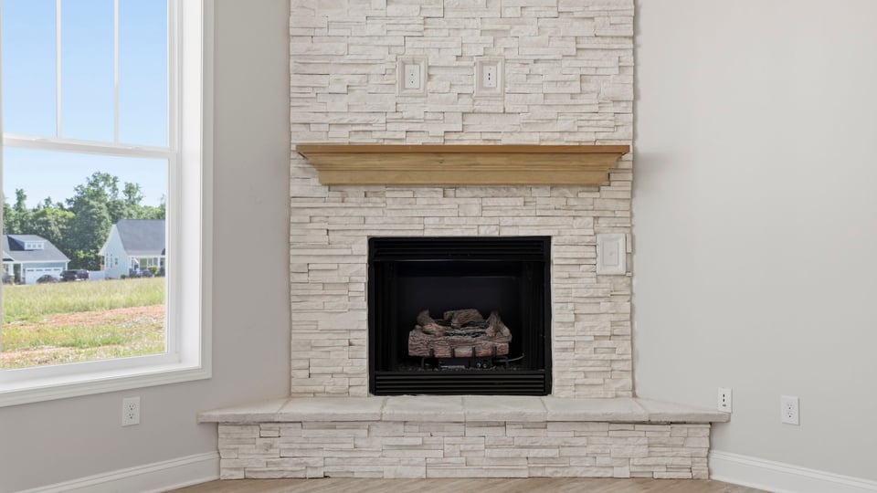 Family room with windows and fireplace.