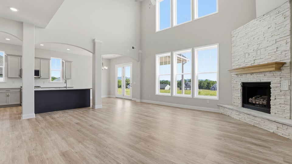 Family room with windows and fireplace.