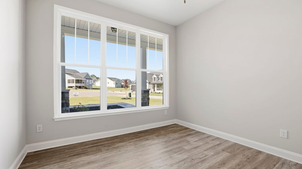 Family room with windows and fireplace.