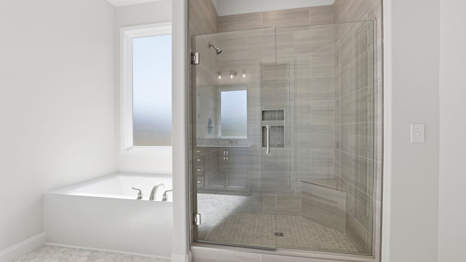 Bathroom with walk in shower.
