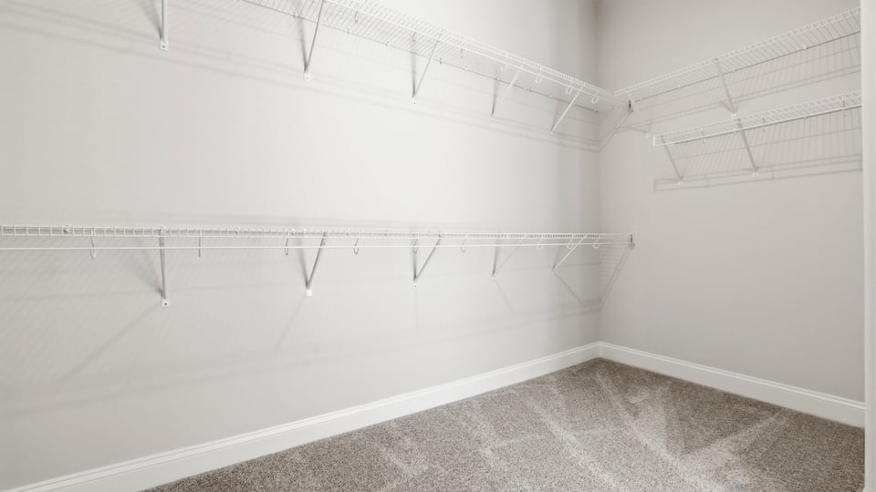 Closet with hanging storage racks.