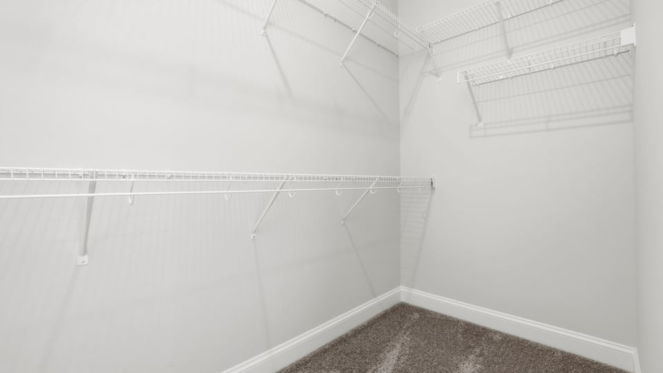 Closet with hanging storage racks.