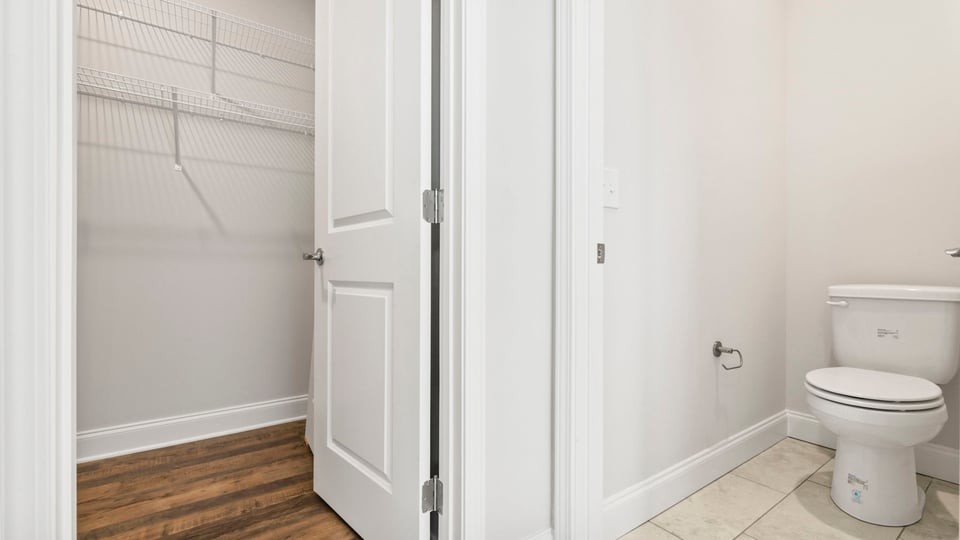 Bathroom with walk in closet.