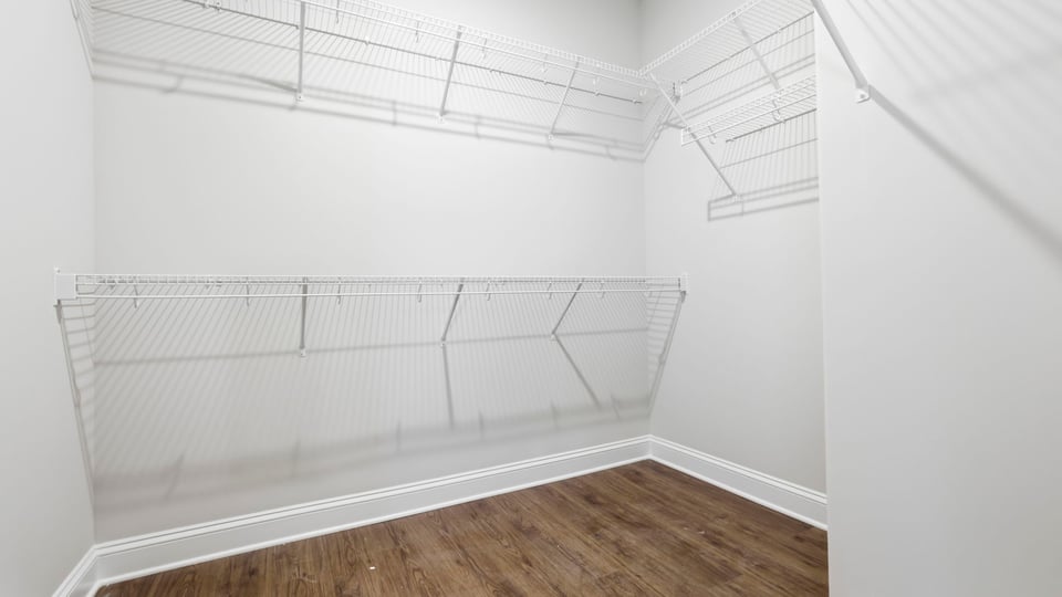 Closet with hanging storage racks.