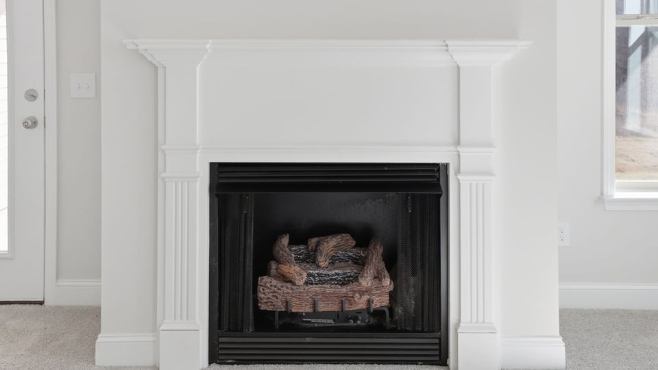 Fireplace with mantle.