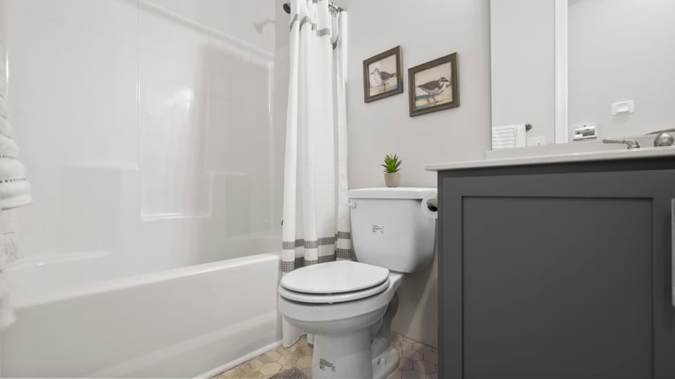 Bathroom with vanity and tub.