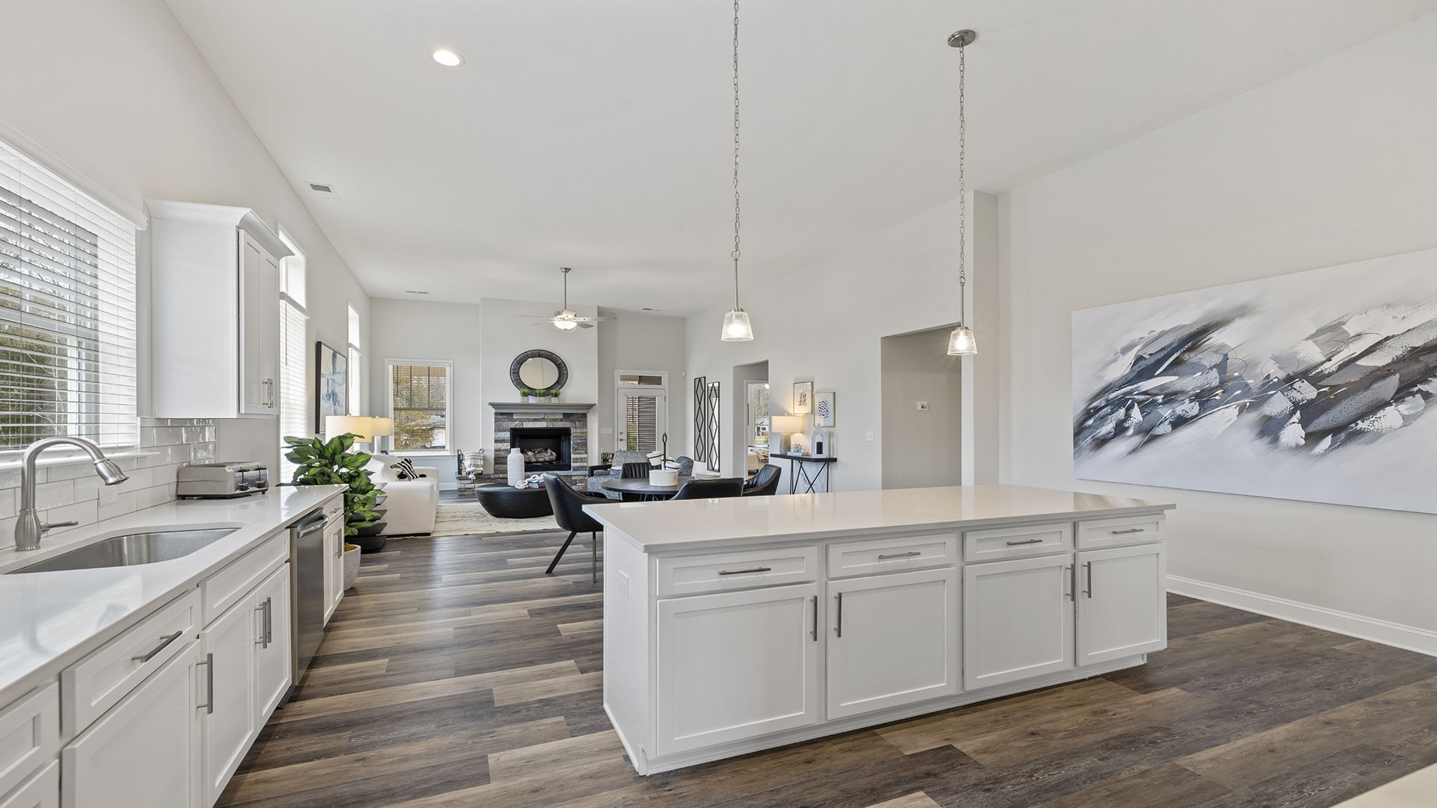 Kitchen with island and quartz countertops.