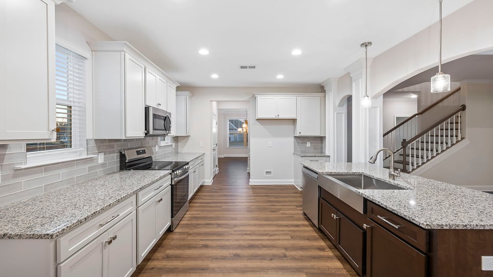 Kitchen and island with granite countertops.