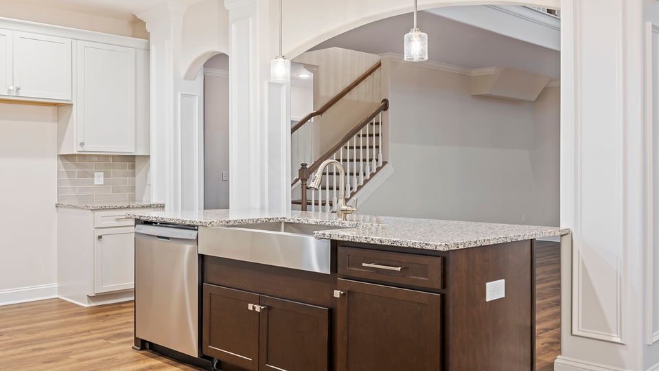Kitchen and island with granite countertops.