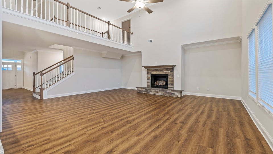 Family room with fireplace and catwalk.