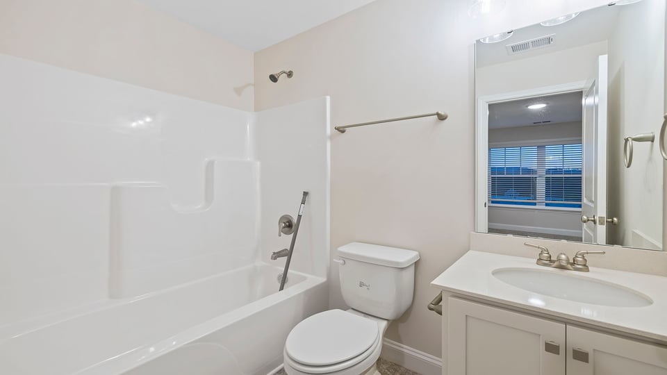 Bathroom with vanity and tub.