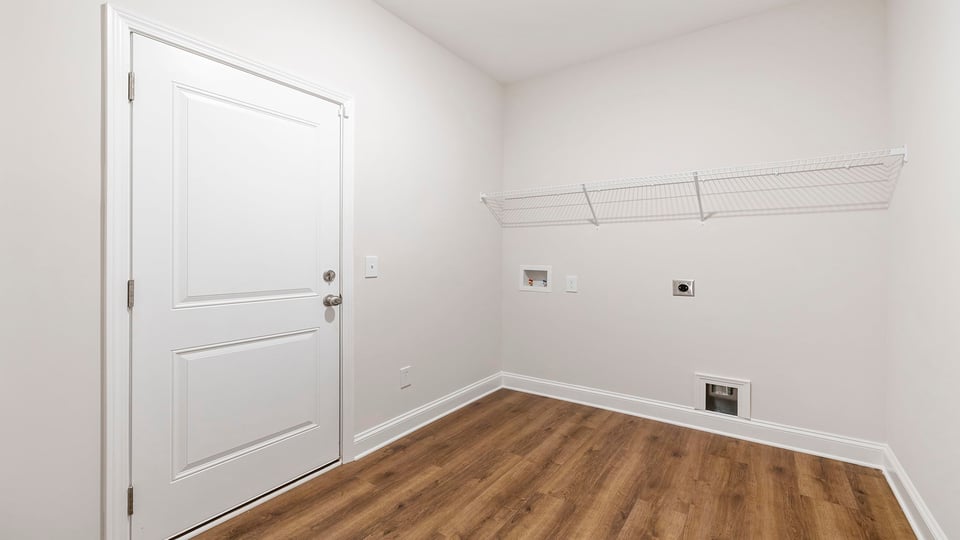 Walk in laundry with shelves.